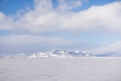 Scenic view of snowcapped mountains against sky