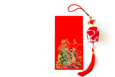 Red christmas decorations over white background