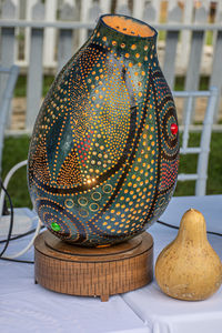 Close-up of electric lamp on table