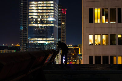 Illuminated buildings in city at night