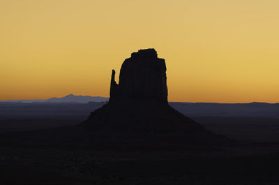 Silhouette of building at sunset