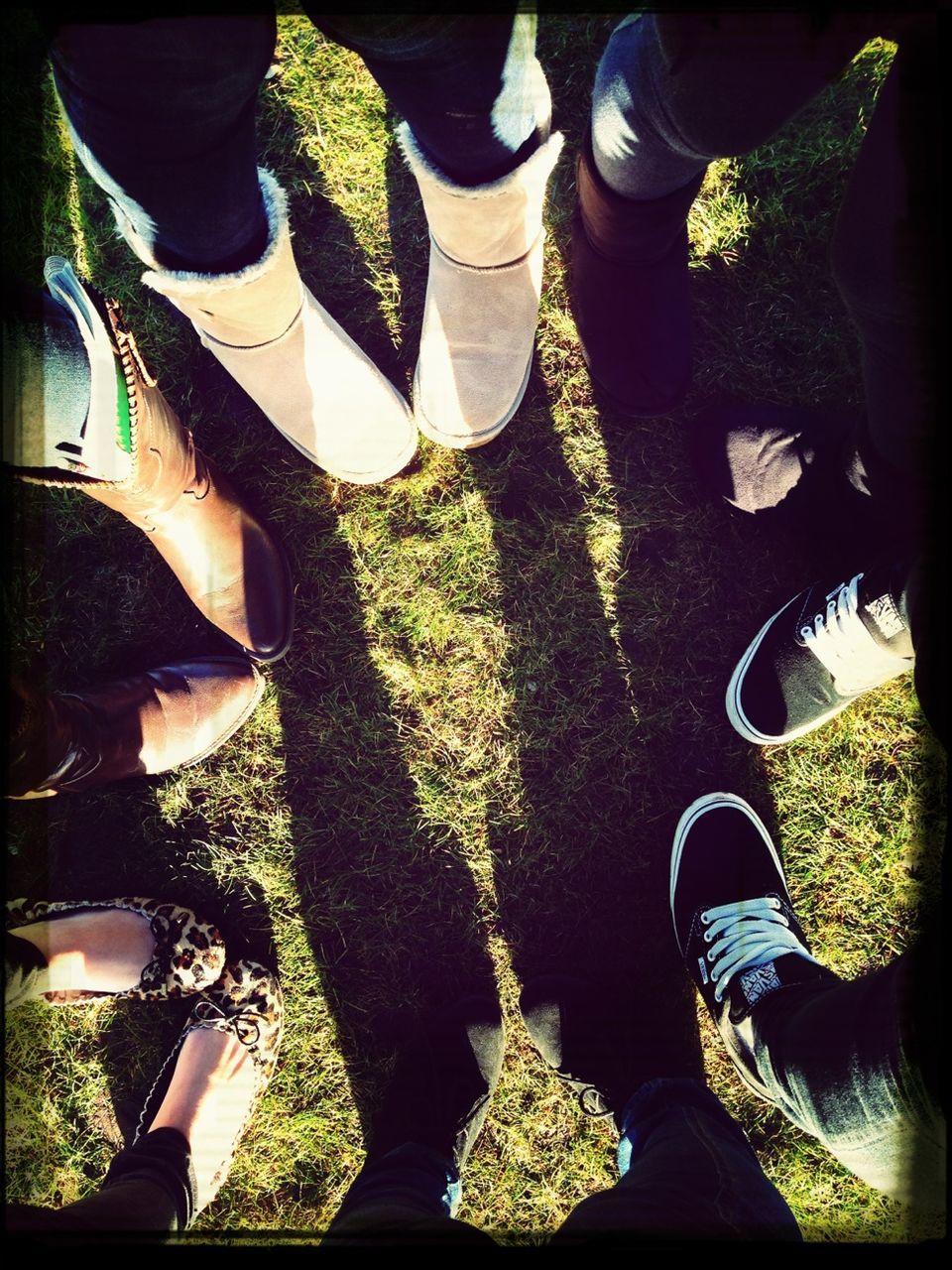 low section, person, shoe, men, lifestyles, standing, human foot, personal perspective, footwear, leisure activity, grass, jeans, high angle view, togetherness, field