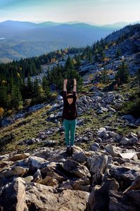 Full length of man standing on rock