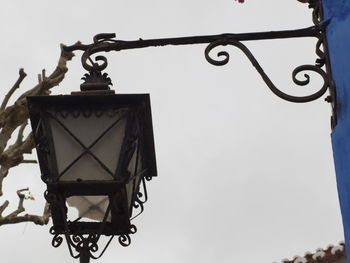 Low angle view of hanging against sky