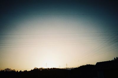 Scenic view of silhouette landscape against clear sky during sunset