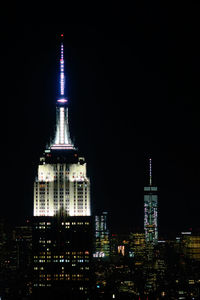 Low angle view of empire state building at night