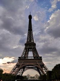 Low angle view of tower against cloudy sky