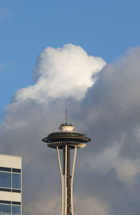 Low angle view of tower in city against sky