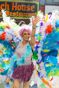 Full length portrait of happy young woman