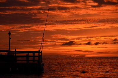 Scenic view of sea against orange sky