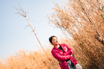 Woman standing on field