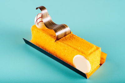 High angle view of bread on table against blue background