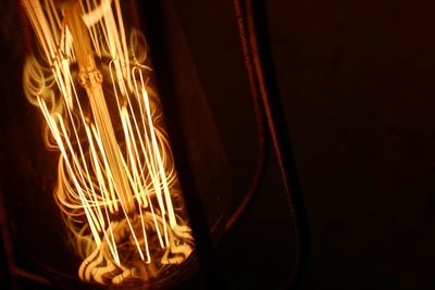 Close-up of illuminated light bulb