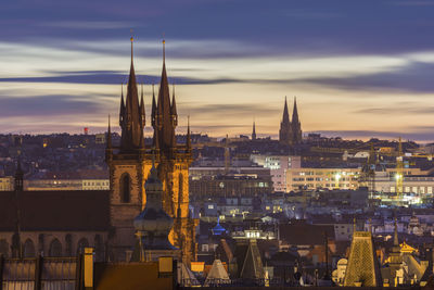 High angle view of illuminated buildings against sky during sunset