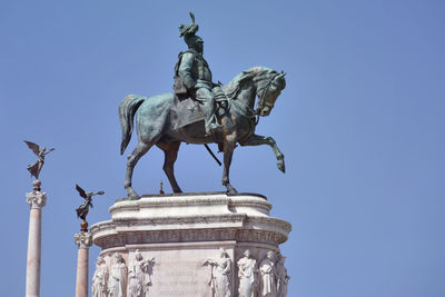 Low angle view of statue against clear sky