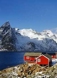 Scenic view of snowcapped mountains against blue sky