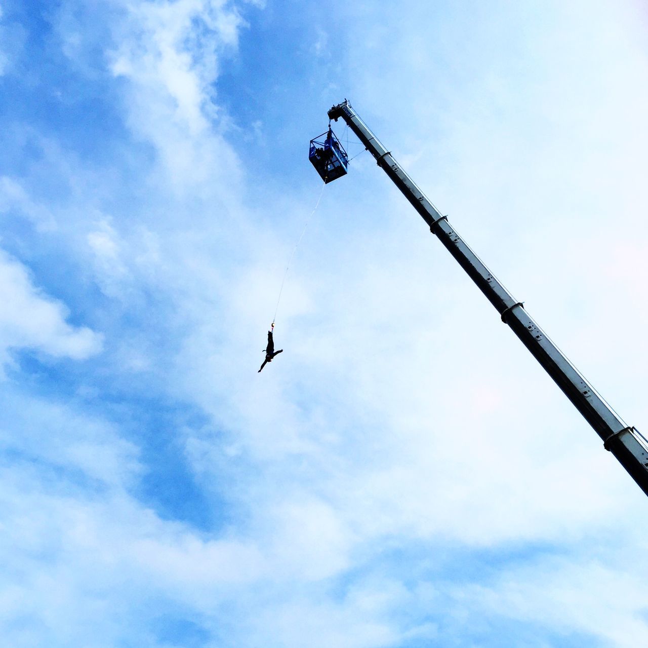 low angle view, sky, flying, cloud - sky, mid-air, transportation, airplane, air vehicle, cloudy, cloud, mode of transport, day, outdoors, on the move, no people, street light, bird, nature, military airplane, hanging