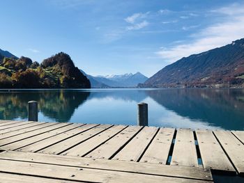 Pier over lake against sky