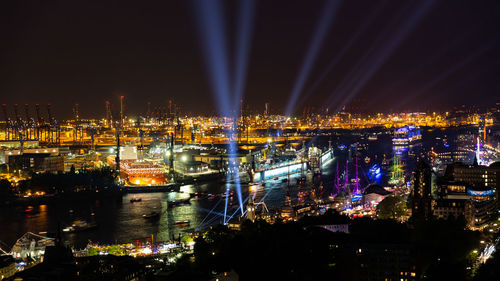 High angle view of illuminated buildings in city at night