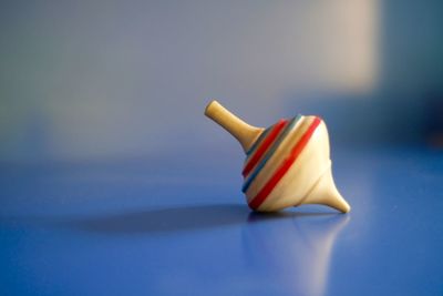 Close-up of paper toy on blue table