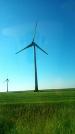 Wind turbines on field