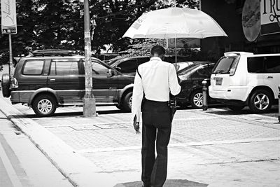 Full length of woman standing on road