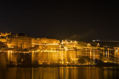 Illuminated buildings in city at night