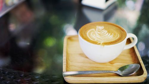 Close-up of coffee cup on table