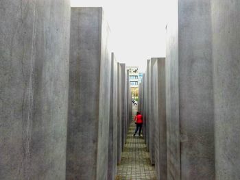 Rear view of woman walking in corridor