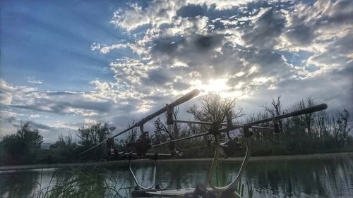 Scenic view of lake against sky at sunset