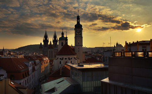 Cityscape against sky at sunset