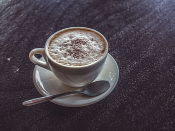 Close-up of coffee cup on table