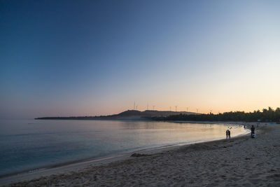 Scenic view of sea against clear sky during sunset