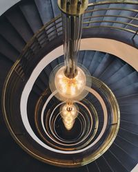 Close-up of illuminated spiral staircase