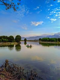 Scenic view of lake against blue sky