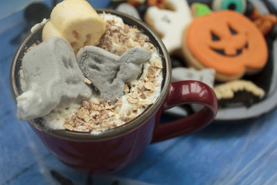 Close-up of cake with coffee on table