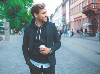 Man looking at city street