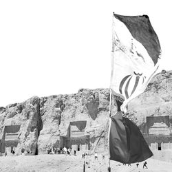 Rear view of flag against built structure