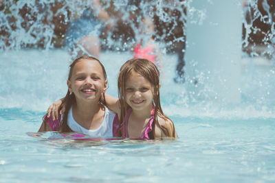 Portrait of smiling boy swimming in pool