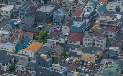 High angle view of street amidst houses in town