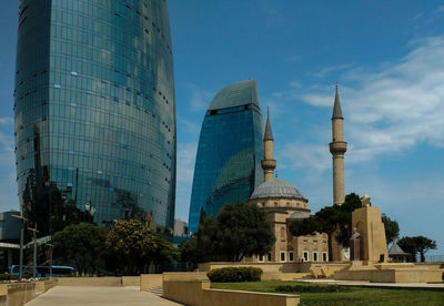 Low angle view of modern buildings against sky