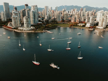 High angle view of modern buildings by sea