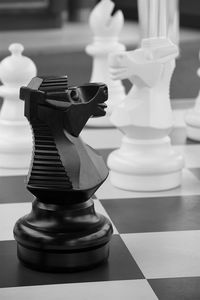 Close-up of chess pieces on table