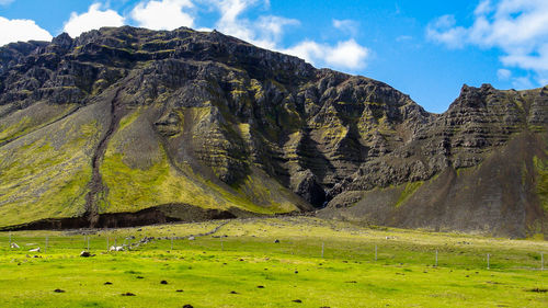 Scenic view of landscape and mountains against sky