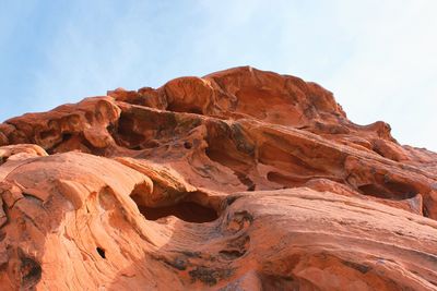 Low angle view of rock formation against sky