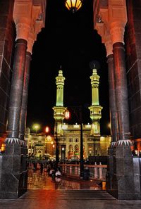 Illuminated temple against sky at night