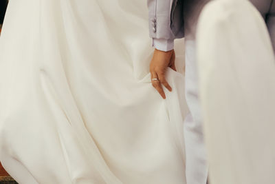 Midsection of couple during wedding