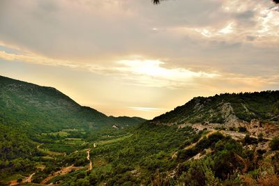 Scenic view of landscape against sky during sunset