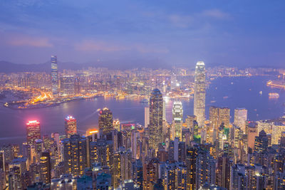 Aerial view of illuminated city buildings at night