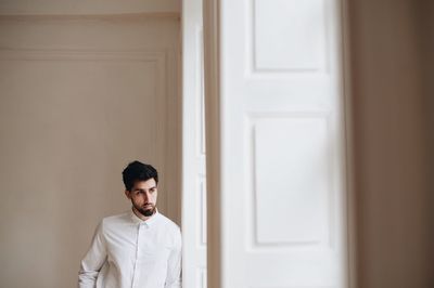 Groom standing by door